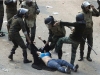 egyptian police beat protester