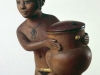 NUBIAN GIRL CARRYING A COSMETIC JAR, C. 1350 B.C. BOXWOOD WITH PIGMENT AND GOLD LEAF. ORIENTAL MUSEUM, DURHAM UNIVERSITY, U.K.﻿
